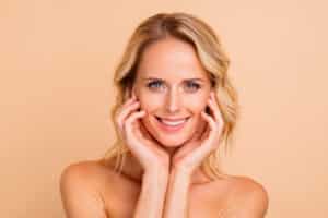 Woman showing smooth skin after Botox treatment.